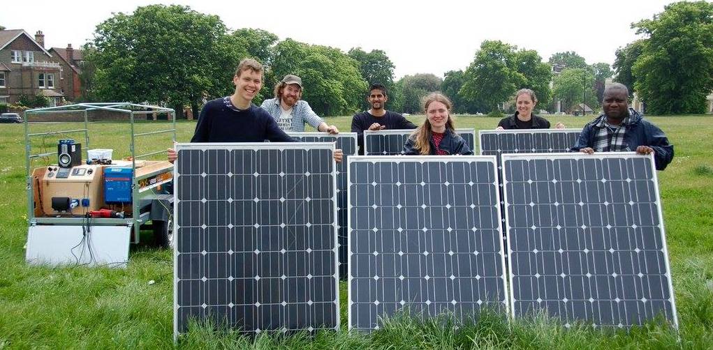 A group of people with solar panels